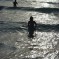 Lady at evening bath on Cala Tarida beach